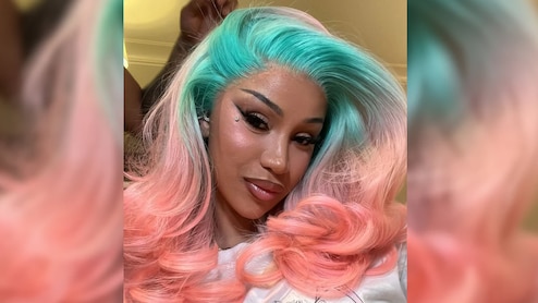 Cardi B Ups Her Glam Game With Harley Quinn Hair, Bronzed Makeup, Bejewelled Cat Eyes, And Shimmery Nude Lips