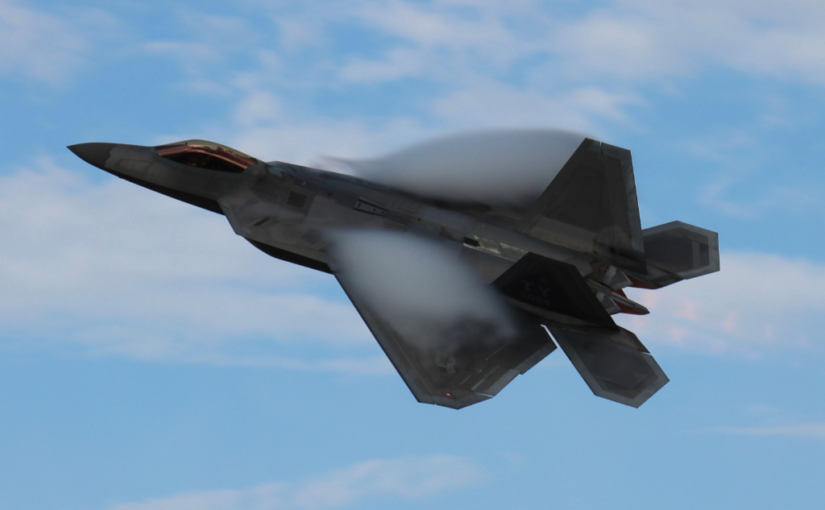 altitude testing showing military jet flying among the clouds